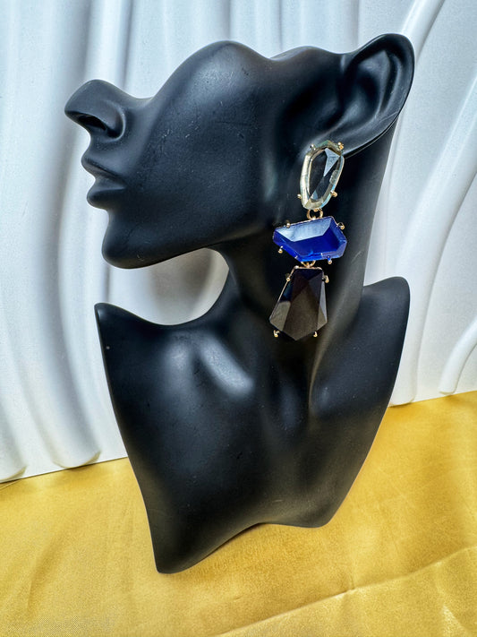 Stunning Seeing Blue Earrings showcased on a stylish black mannequin against a gold background. Perfect for any occasion!