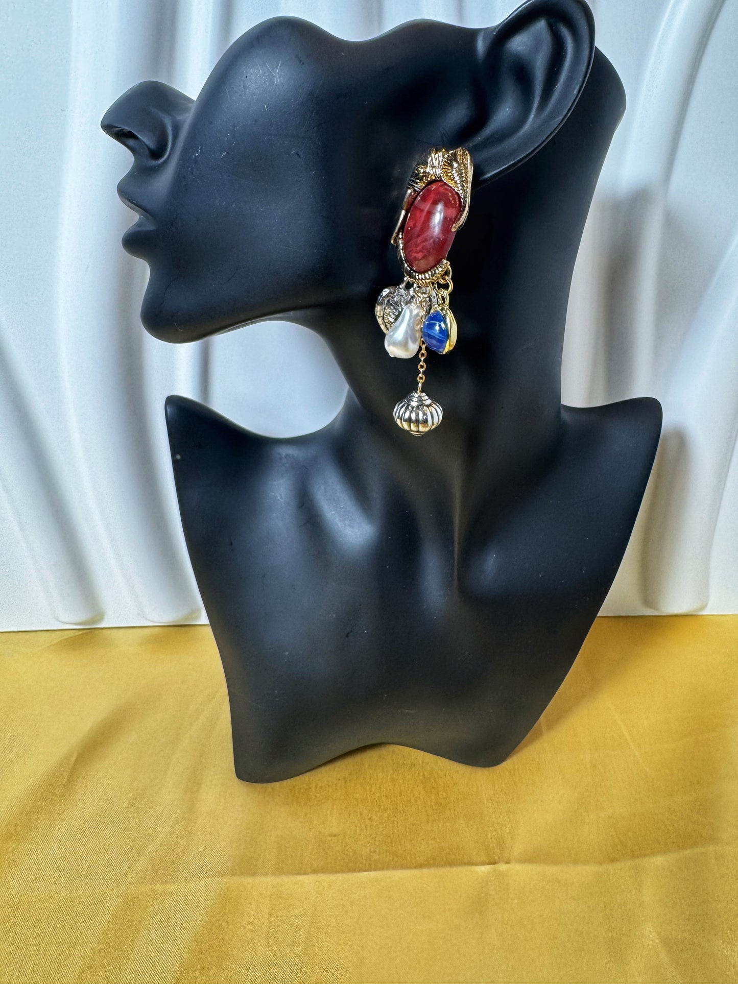 Elegant Elephant Retro Earrings displayed on a stylish mannequin, featuring colorful jewels and intricate design.
