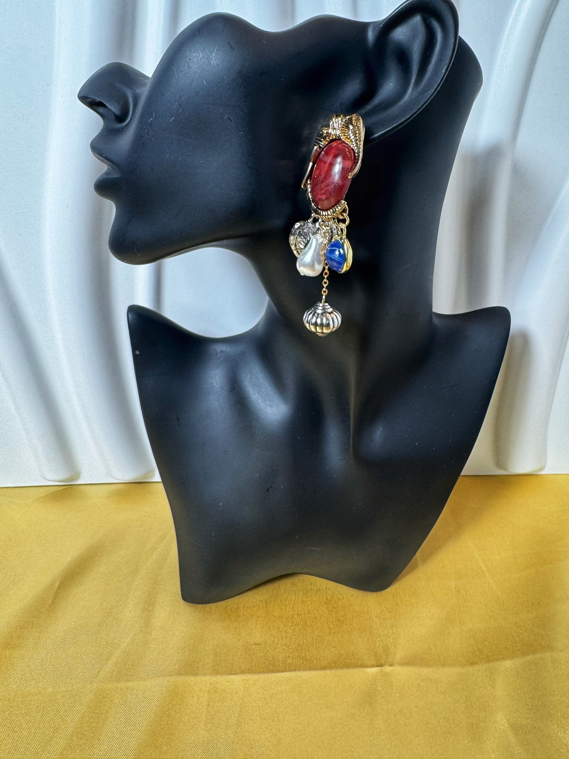 Elegant Elephant Retro Earrings displayed on a stylish mannequin, featuring colorful jewels and intricate design.