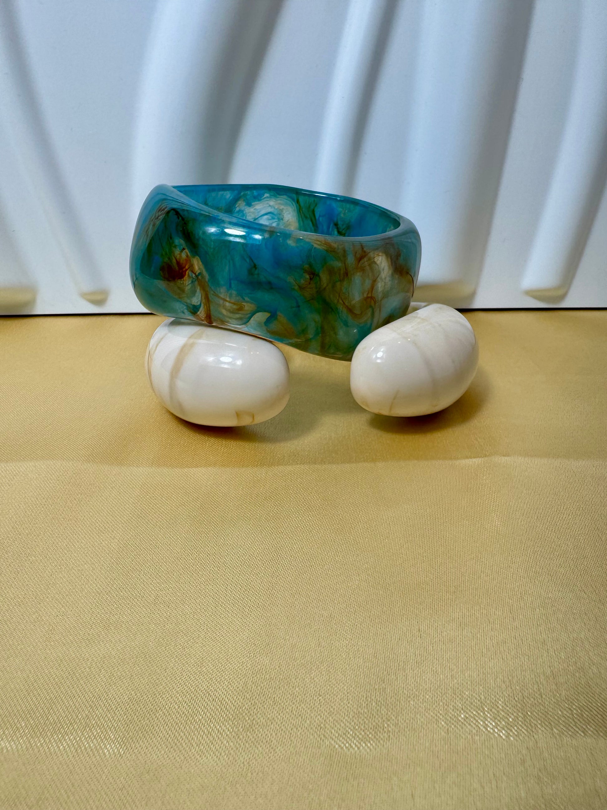 Vibrant Tie-Dye Resin Bangle showcasing a unique blend of colors, perfect for elevating your accessory collection.
